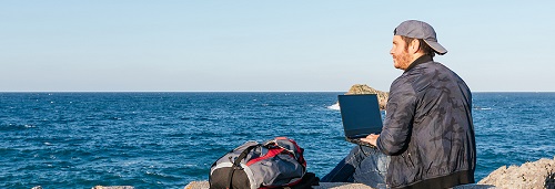 bigstock Traveler Man Sitting In Front 417212950